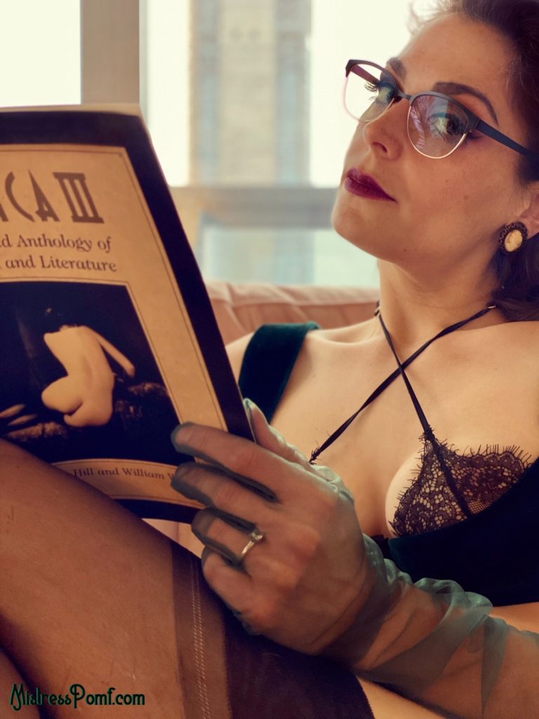 Pro Domme Mistress Pomf indulges in BDSM roleplay fetish as she looks at you through her sexy librarian glasses whilst reading an erotica book from her BDSM library.