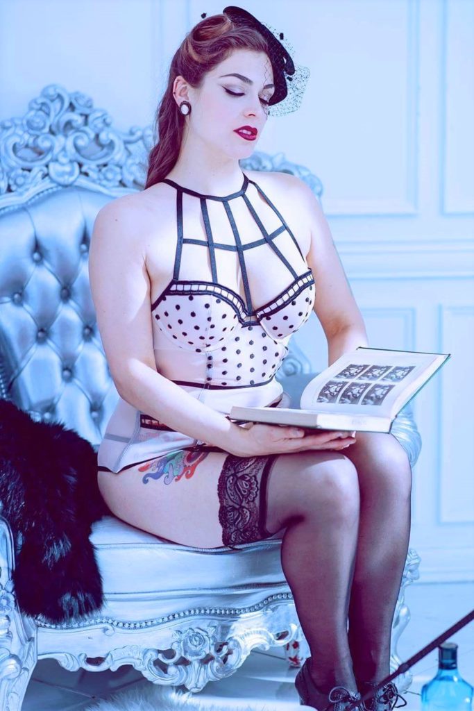 Pantyhose Dominatrix Mistress Pomf roleplays as the sexy librarian as she reads from an erotic art history book from her BDSM library.