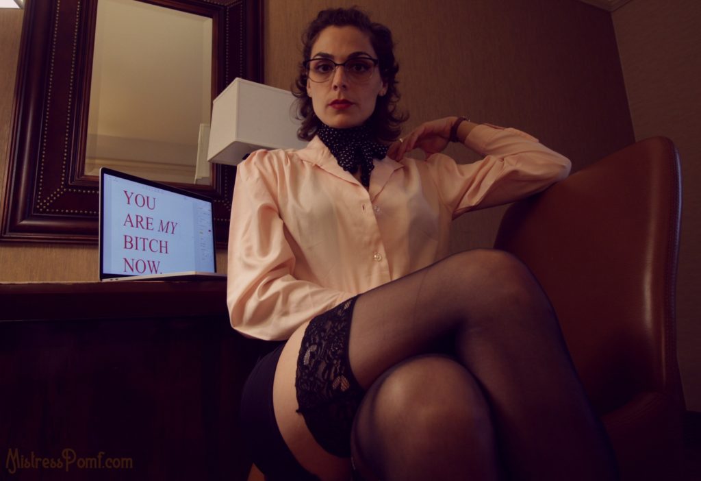 NYC Dominatrix Mistress Pomf roleplays as the Secretary in an erotic blackmail fetish scene.